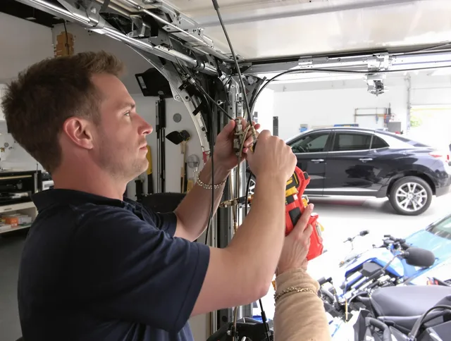 North Haven Garage Door Repair safety certified technician performing cable replacement in North Haven