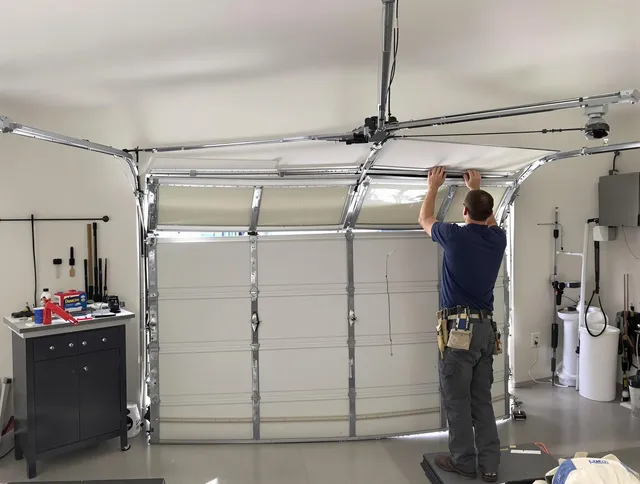 North Haven Garage Door Repair specialist performing precise section replacement on North Haven garage door